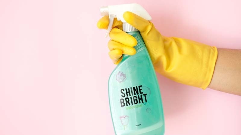 Man holding a cleaning spray