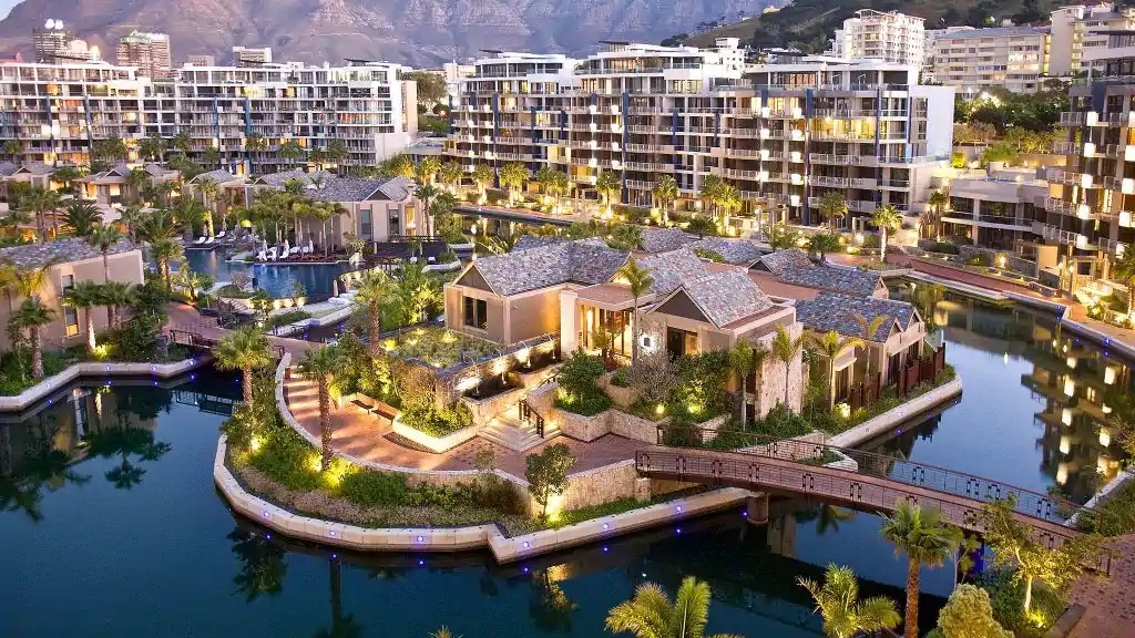 An aerial view of a luxurious resort with lush landscaping and water features. Fabulous Flowers and Gifts