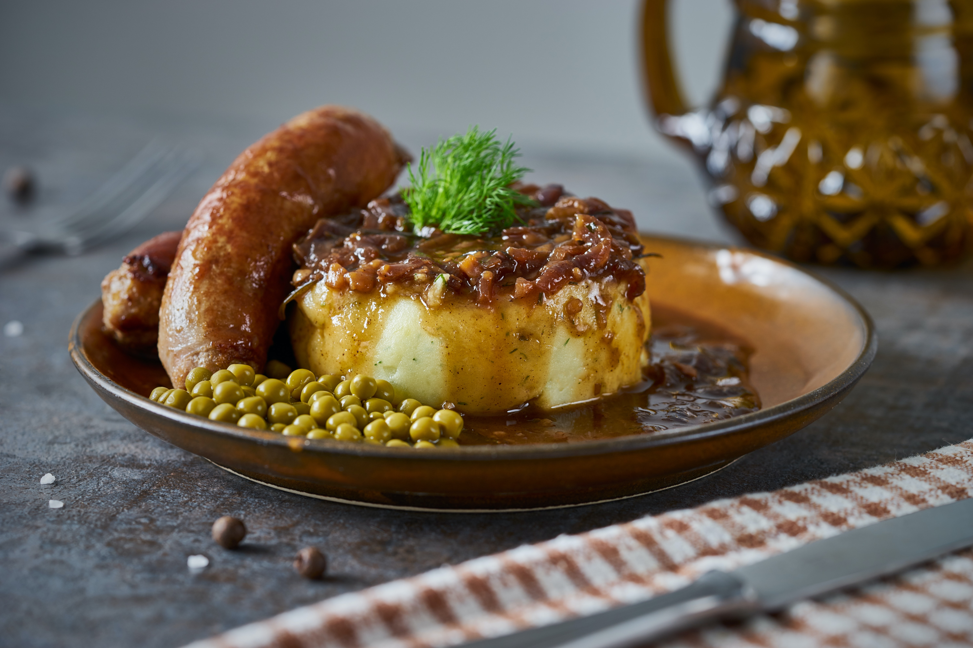 One of our all time favourites is plump sausages and mash with lashings of gravy! Would you eat it with tomato sauce?