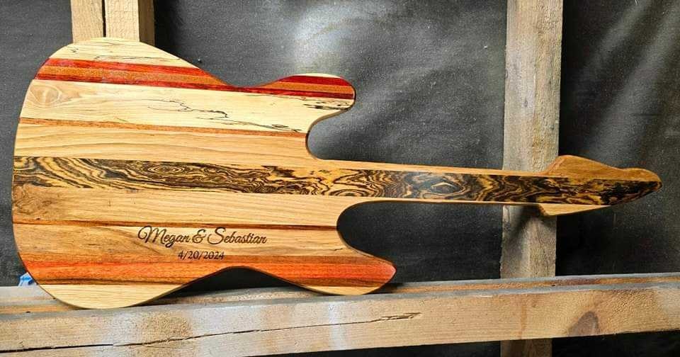 A guitar body made by Kevin using tools in his workshop.