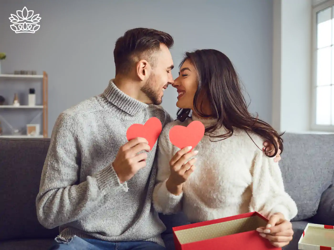 Couple exchanging heart-shaped gifts on Valentine's Day - Fabulous Flowers and Gifts, National Occasions.