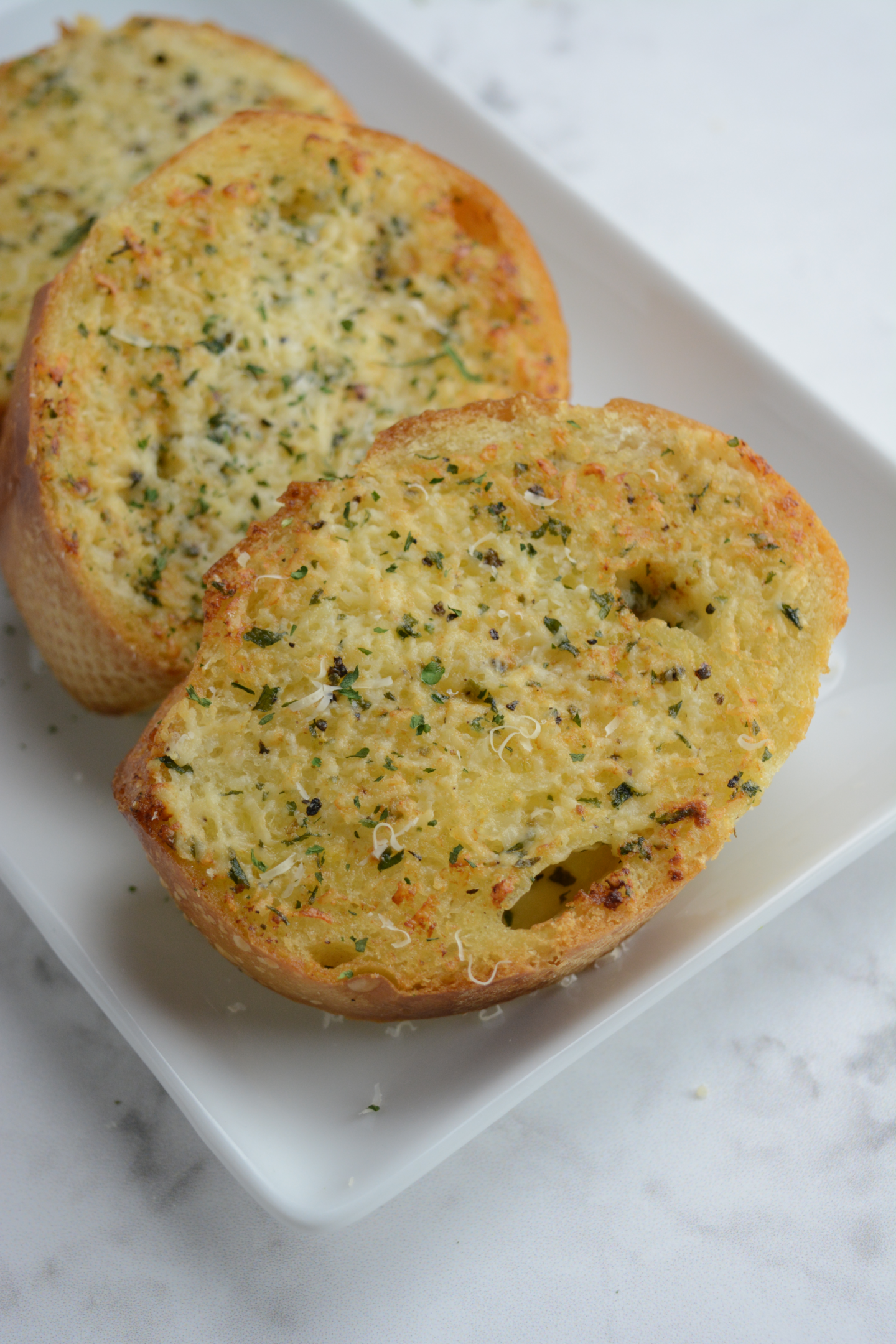 three slices of garlic bread made in the air fryer.