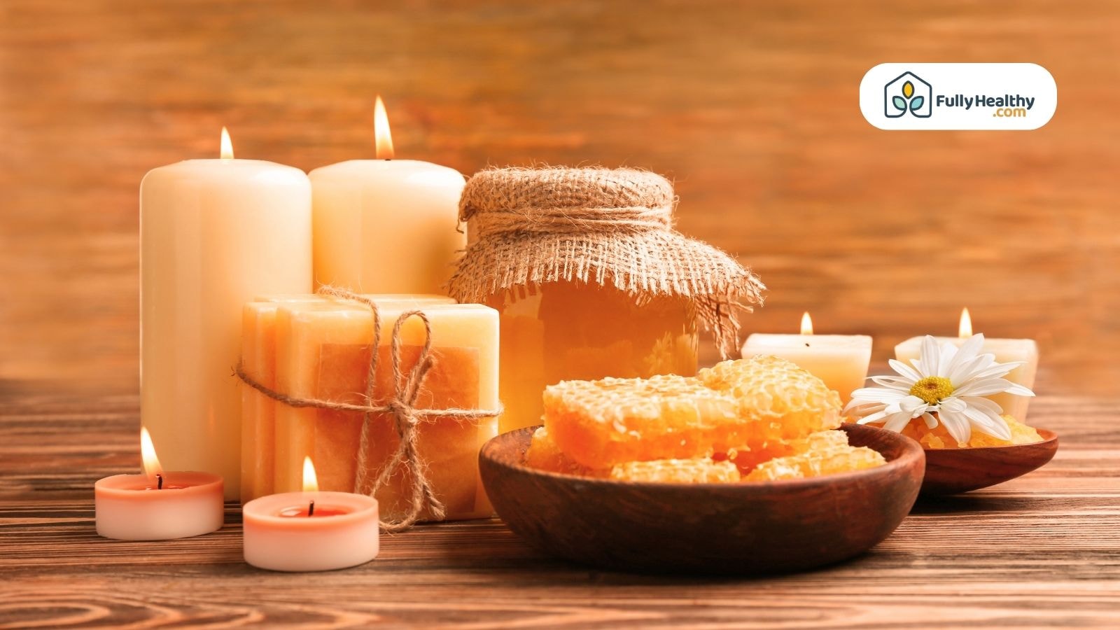 Honeycomb, jar of honey, and candles arrangement