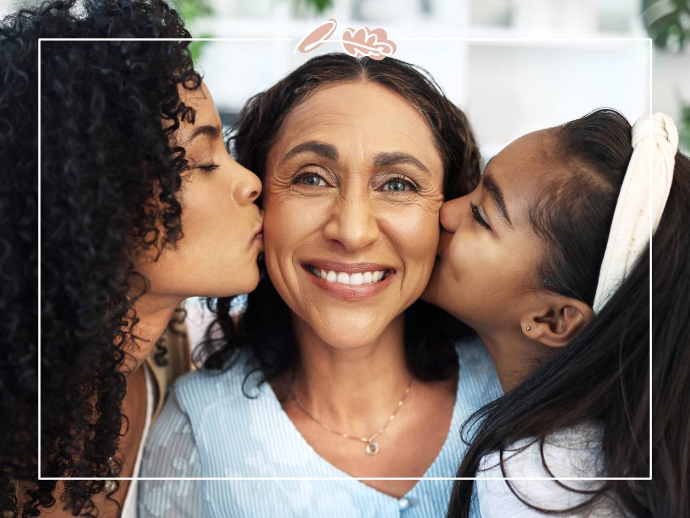 Mother being kissed by her two daughters, radiating love and happiness. A perfect moment of affection and gratitude.