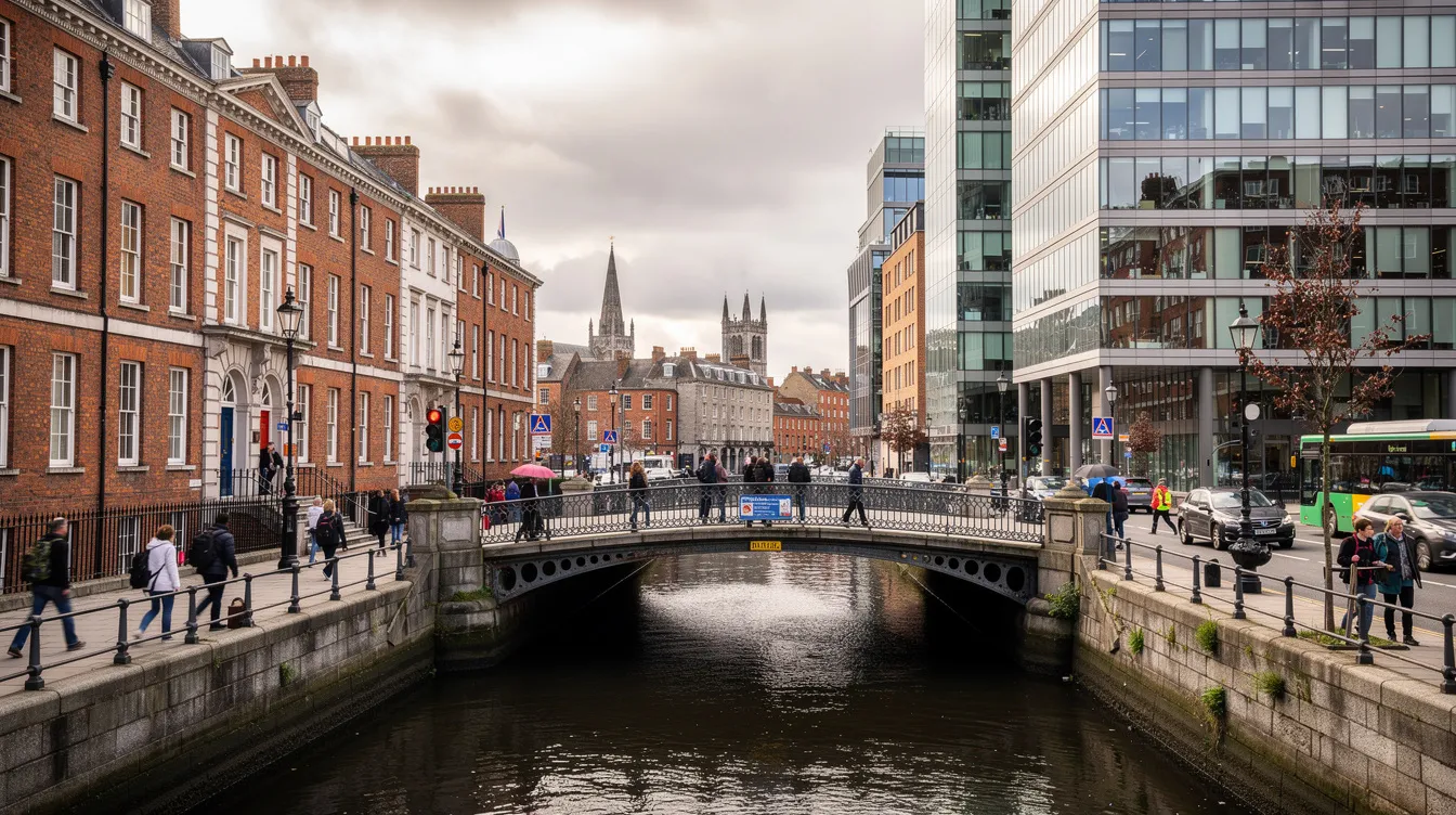 The image depicts a bustling modern street in Dublin, showcasing a blend of Georgian architecture and contemporary buildings, with pedestrians crossing a bridge over the river Liffey. This scene reflects the vibrant life of Irish citizens and immigrants, highlighting the city's rich history and diversity.