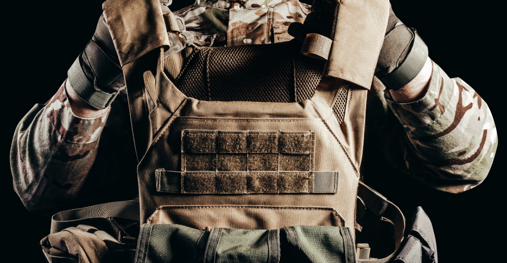 soldier holding tactical gear