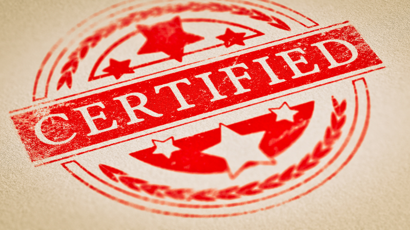A red fabric certificate stamp with the word certified on it