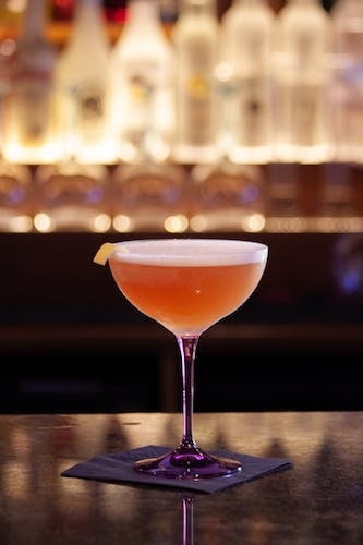 Close-up shot of the glass of a speakeasy bar located near me