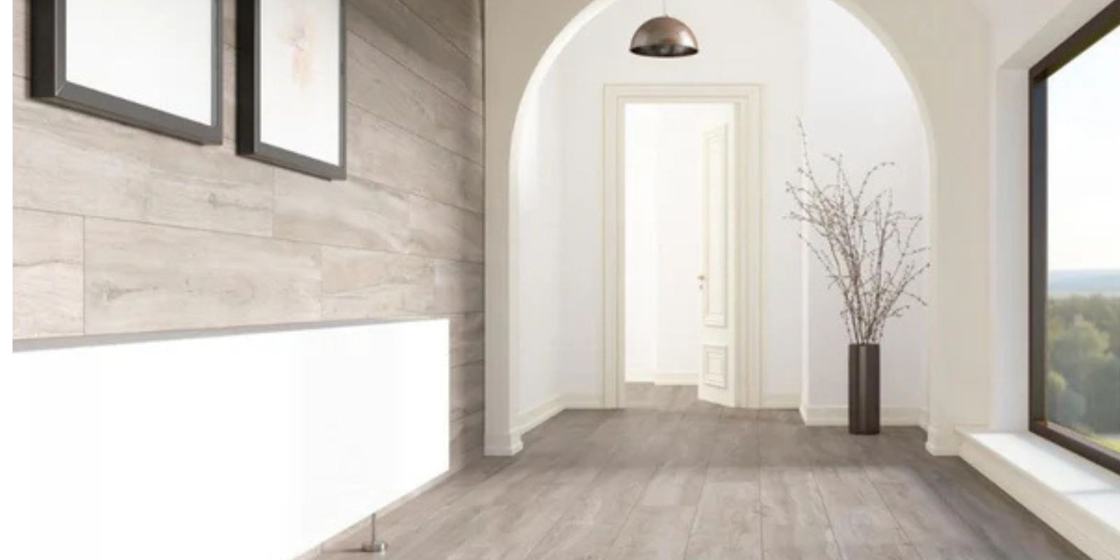 Minimalist hallway with light wood flooring, large window, arched doorway, and a tall black vase with branches.