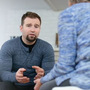 man talking to mental health professional