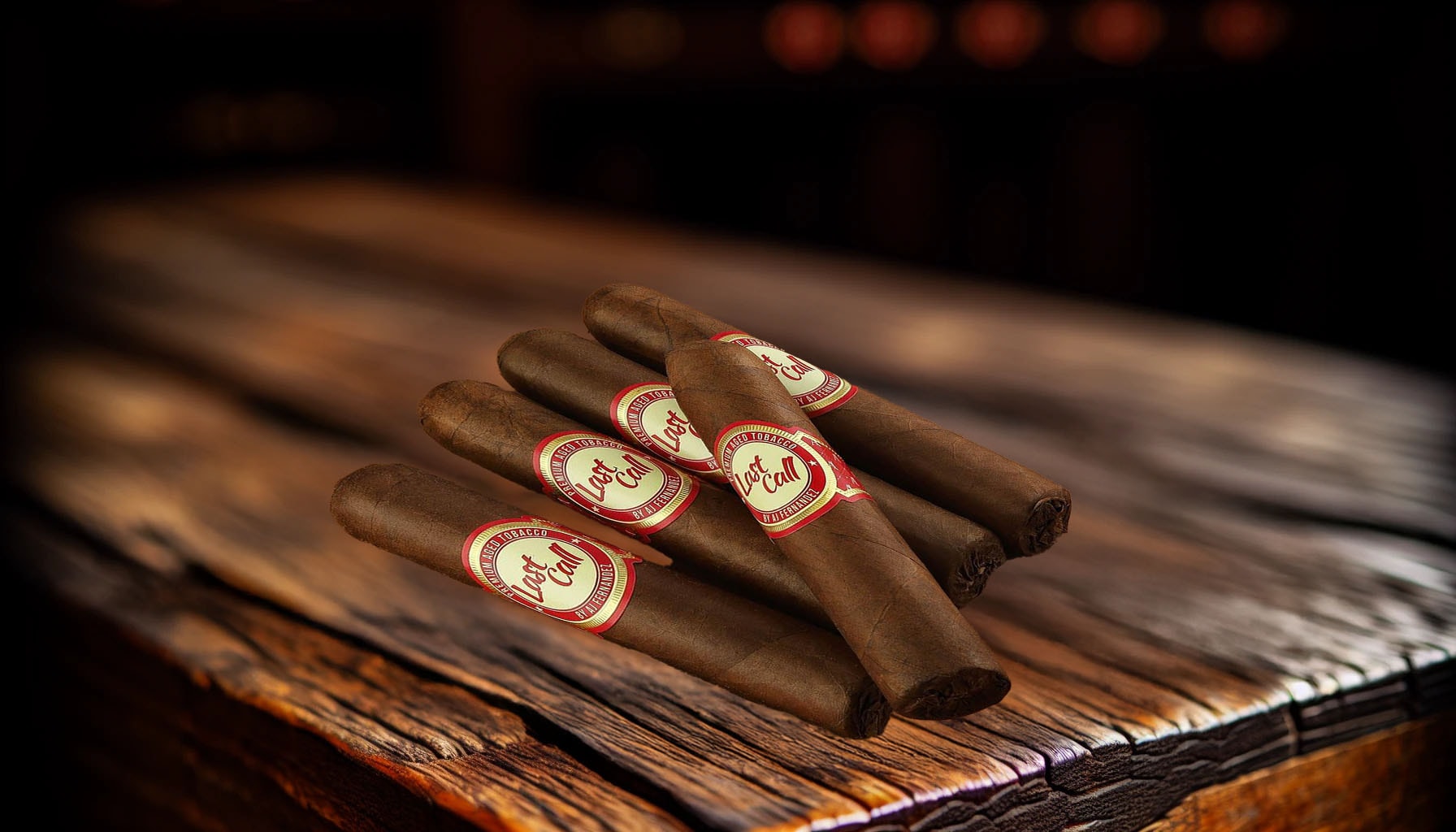 A group of Last Call Habano Corticas arranged on a rustic tabletop