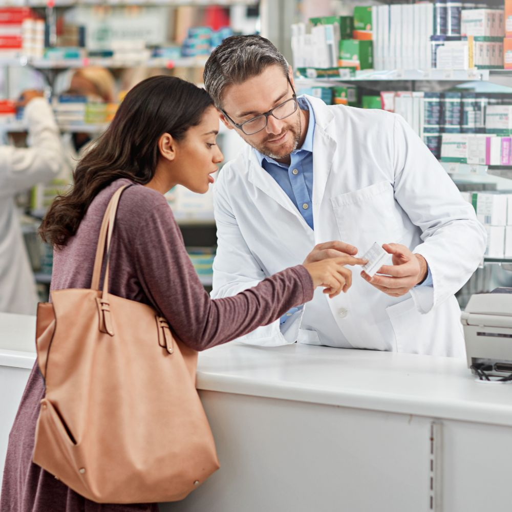 A person holding a bottle of over-the-counter medication, highlighting the risks of drug-induced liver injury.