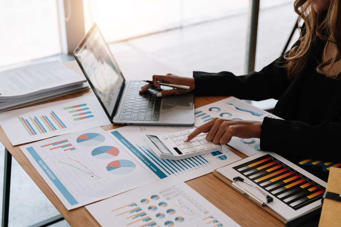 Business analyst reviewing supplement brand’s production and cost efficiency data