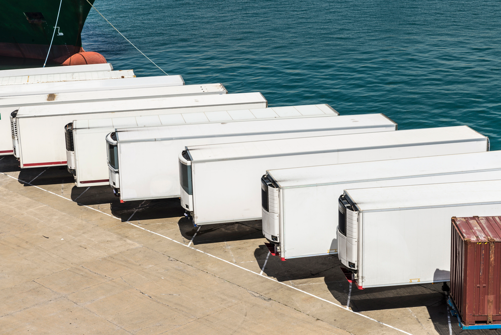 refrigerated trailers parked at shipping dock