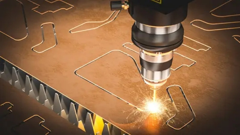 A laser cutter creating repeating stencils on a metal sheet