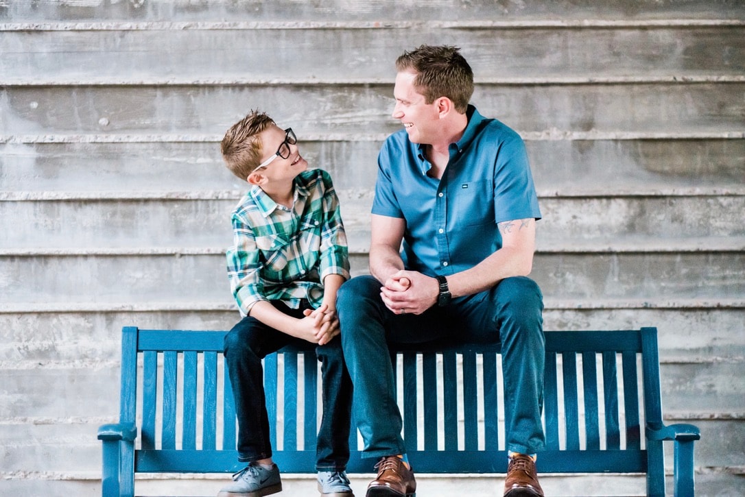 A portrait photography session with a family in a park.