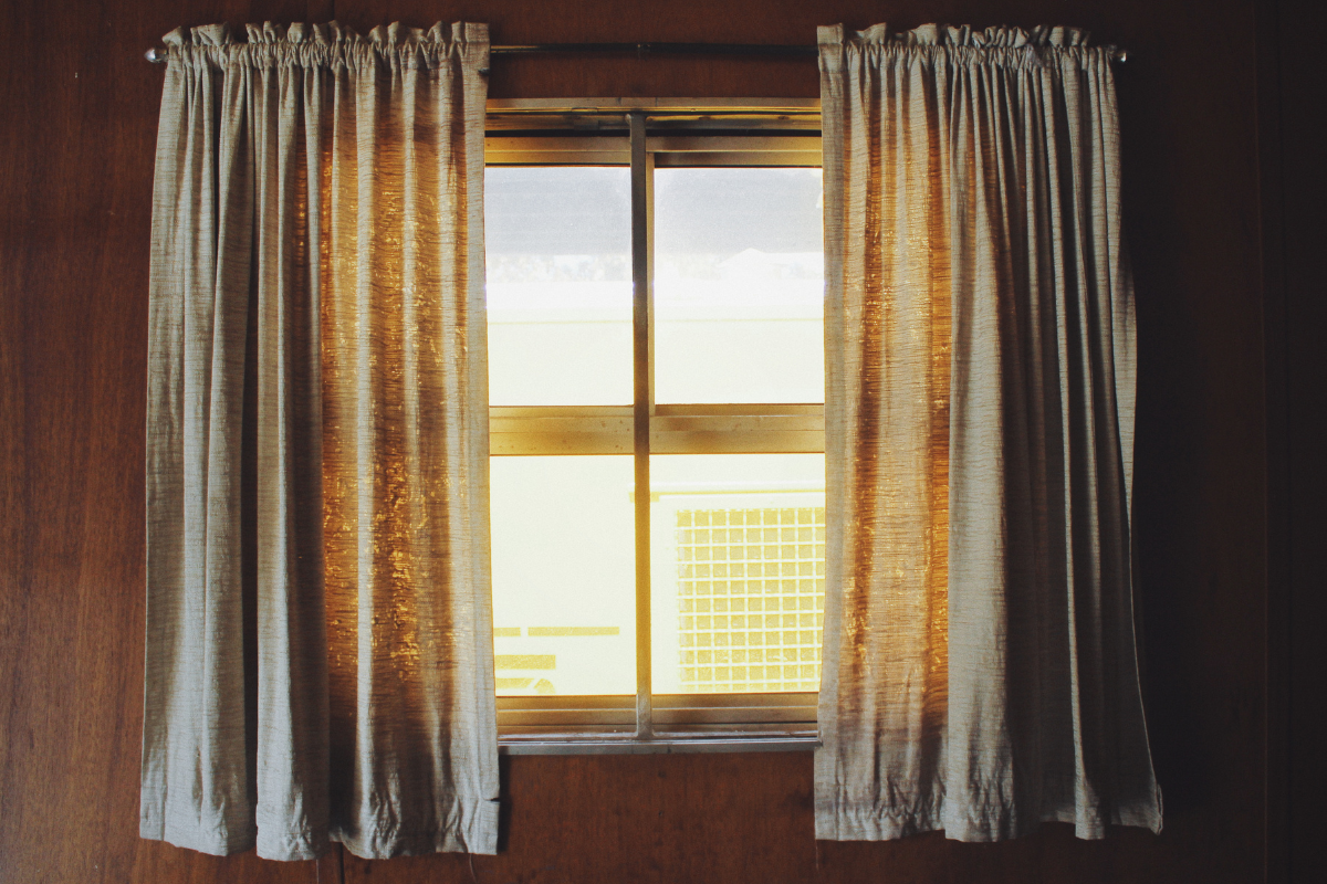 Illustration of curtain rod extending beyond the window frame