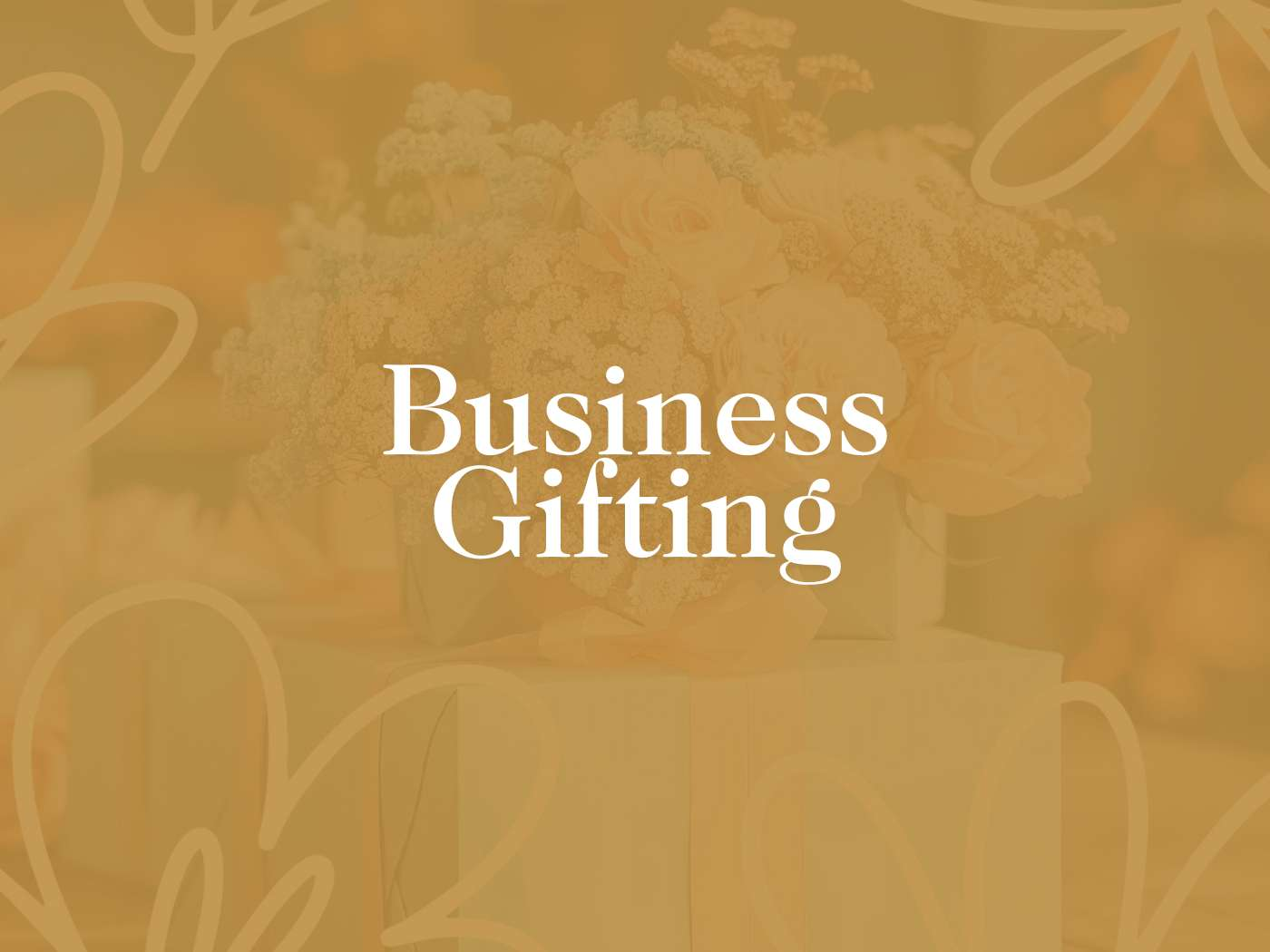 Business Gifting' prominently displayed over a soft-focus backdrop of elegant floral arrangements, encapsulating the professional gifting services offered by Fabulous Flowers and Gifts.