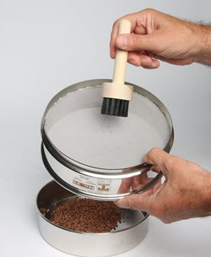 A stainless steel sieve with a diameter, used to separate particles from a sample