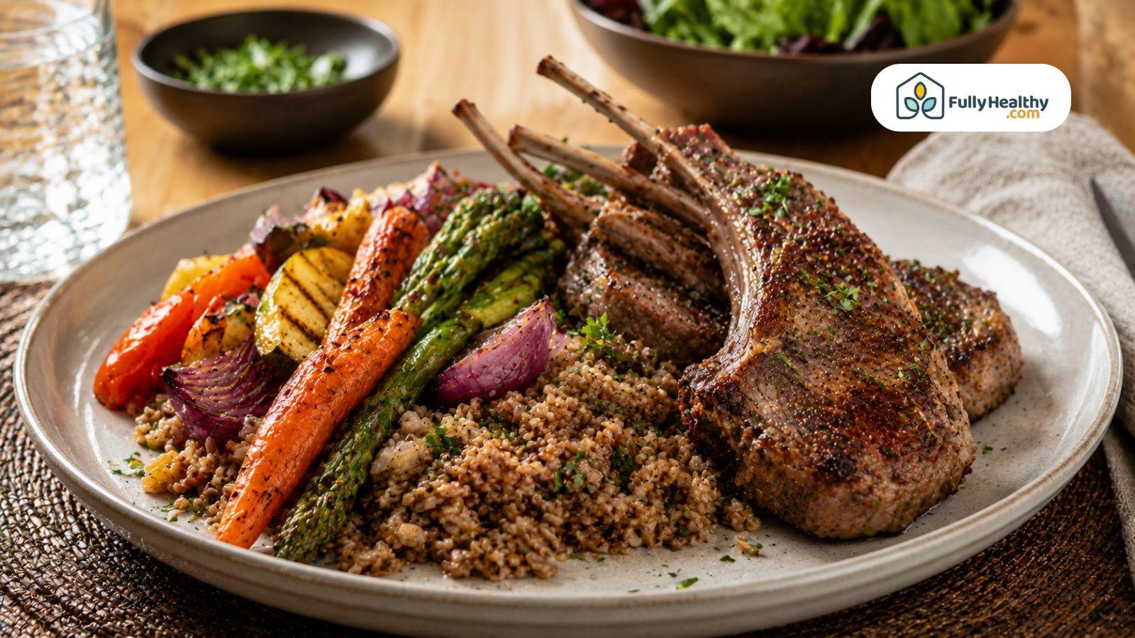 Grilled lamb chops served with roasted vegetables, asparagus, red onion, and whole grains on a plate.