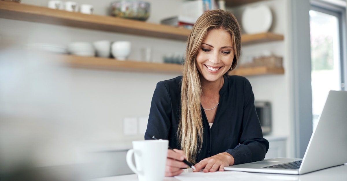 A content creator working diligently on her Onlyfans tax organizer, ensuring all tax documents are in order.