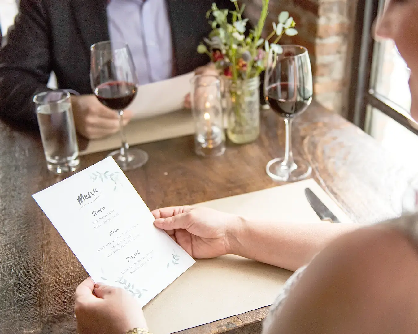 Close-up restaurant menu typography demonstrating font hierarchy and visual branding