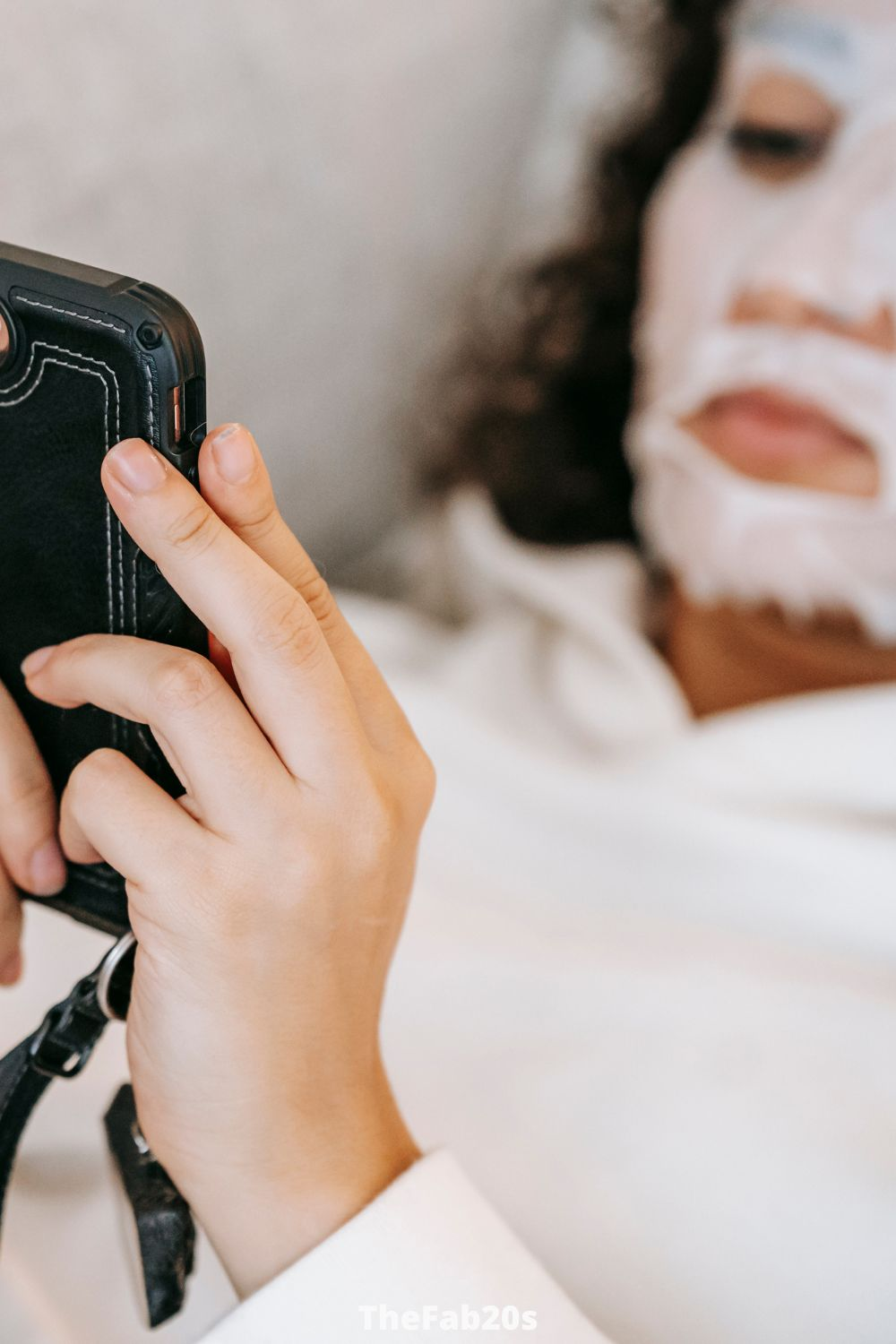 Woman with face mask checking phone