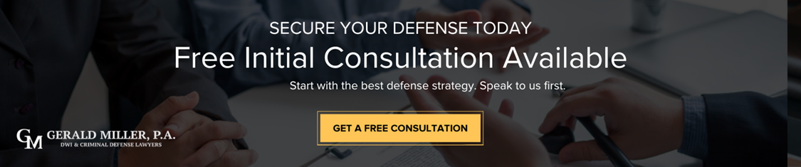 Experienced Minnesota defense attorney explaining legal options to a client accused of strong arm robbery, focusing on building a strong case.