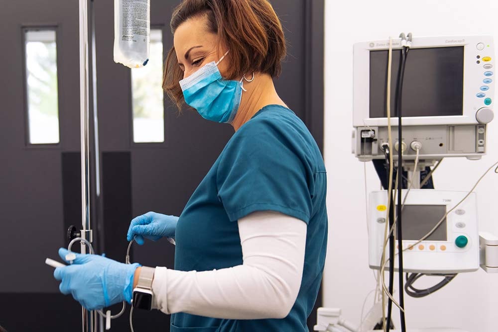 nurse helping with preparing for the surgery