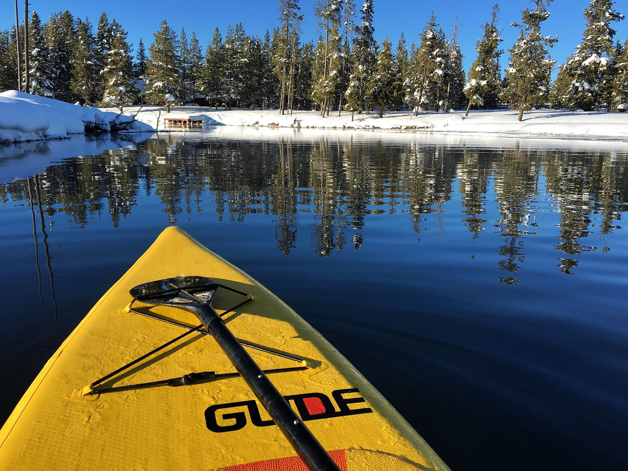 inflatable stand up paddleboard on a snowy lake