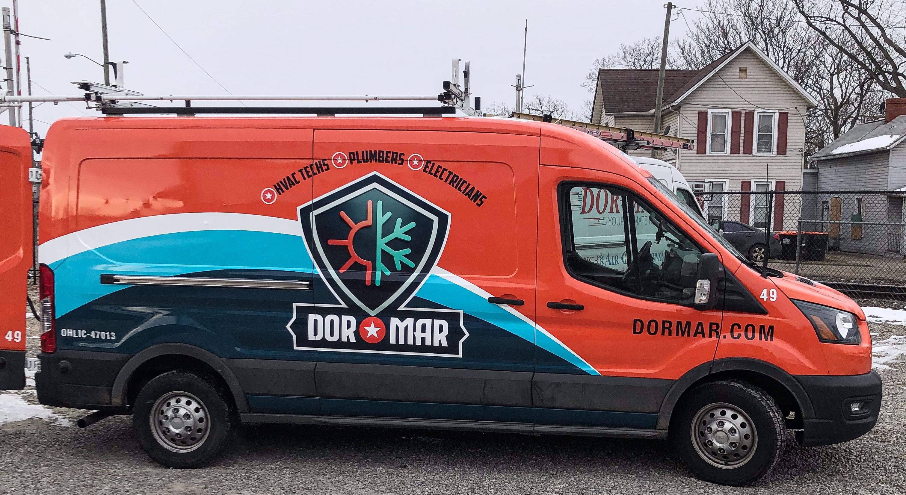 A service van is parked in a residential driveway, indicating the presence of a reliable HVAC technician ready to assist homeowners with air conditioning and heating services. The van represents a commitment to home comfort and energy efficiency, offering innovative solutions for maintaining HVAC systems.