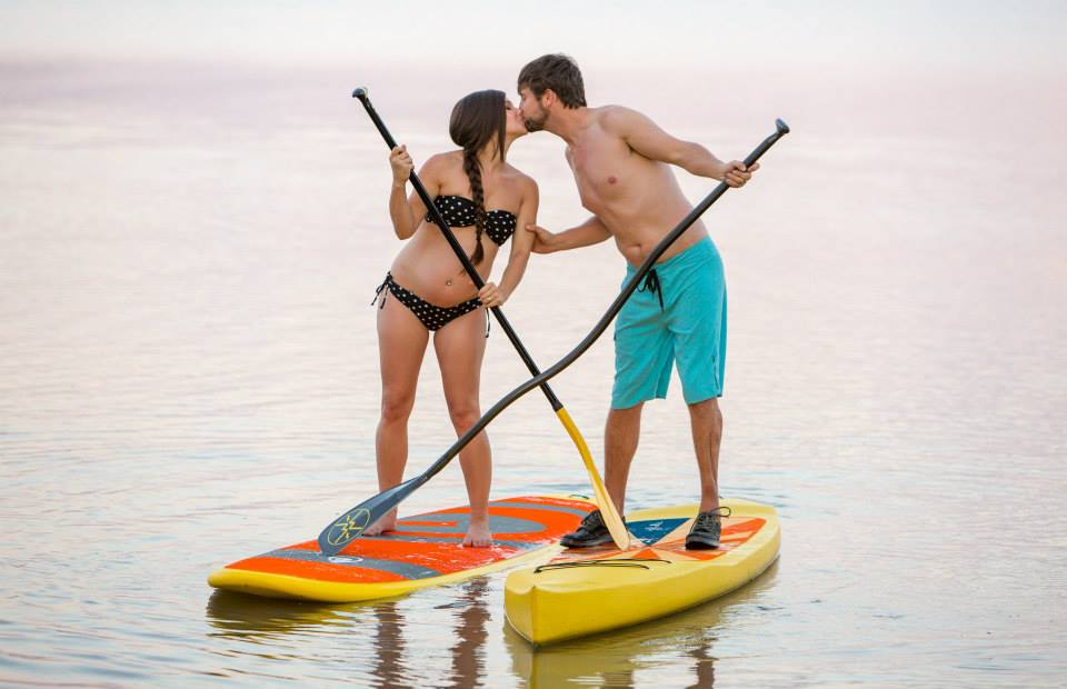 couple on paddle boards