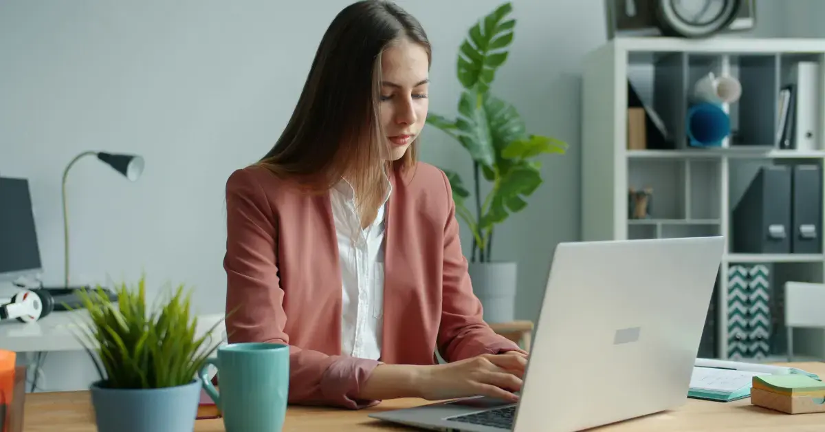 Woman reviewing tax documents and bank statements for proof of income for self-employed creators.