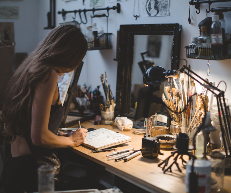 a woman works in her studio