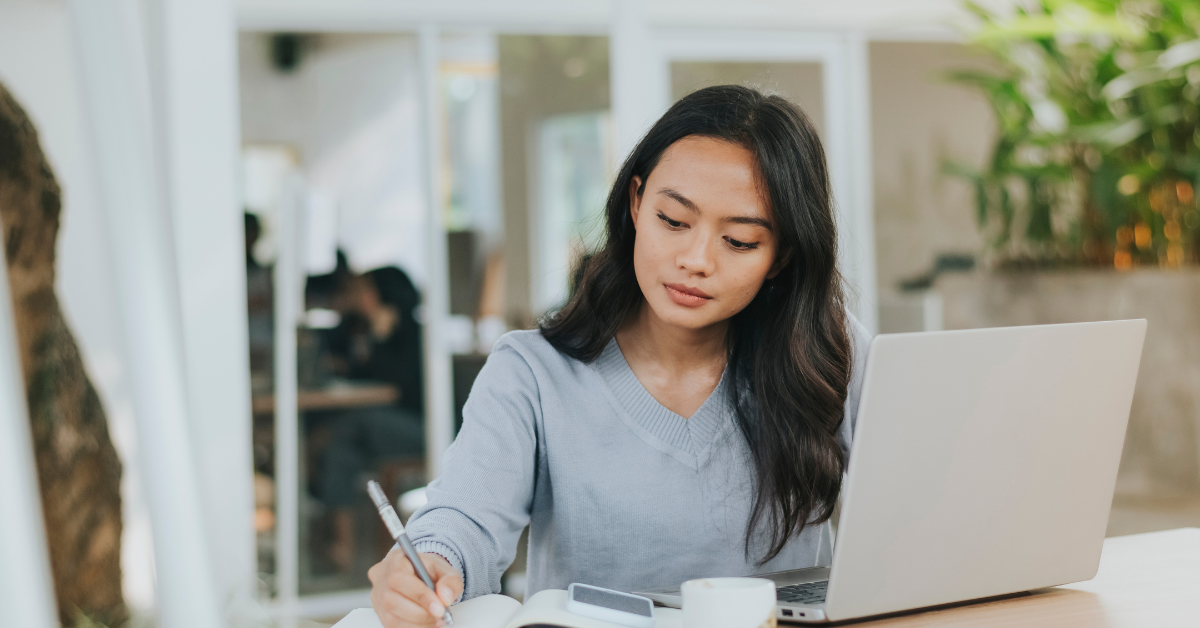 Young woman studying "How can I file back taxes for onlyfans income"