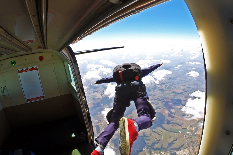 Skydiver jumping out of a plane