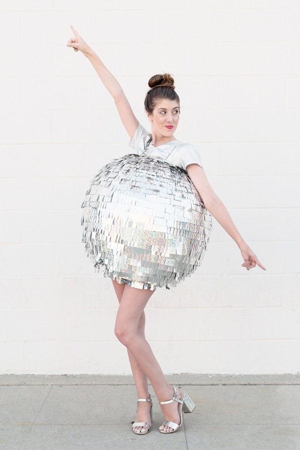 Turn heads at your party in this large size disco ball costume. This woman DIYed it for a Halloween party.