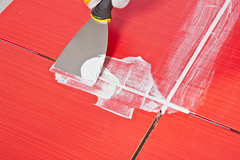 White tile grout with common discoloration causes and prevention tips