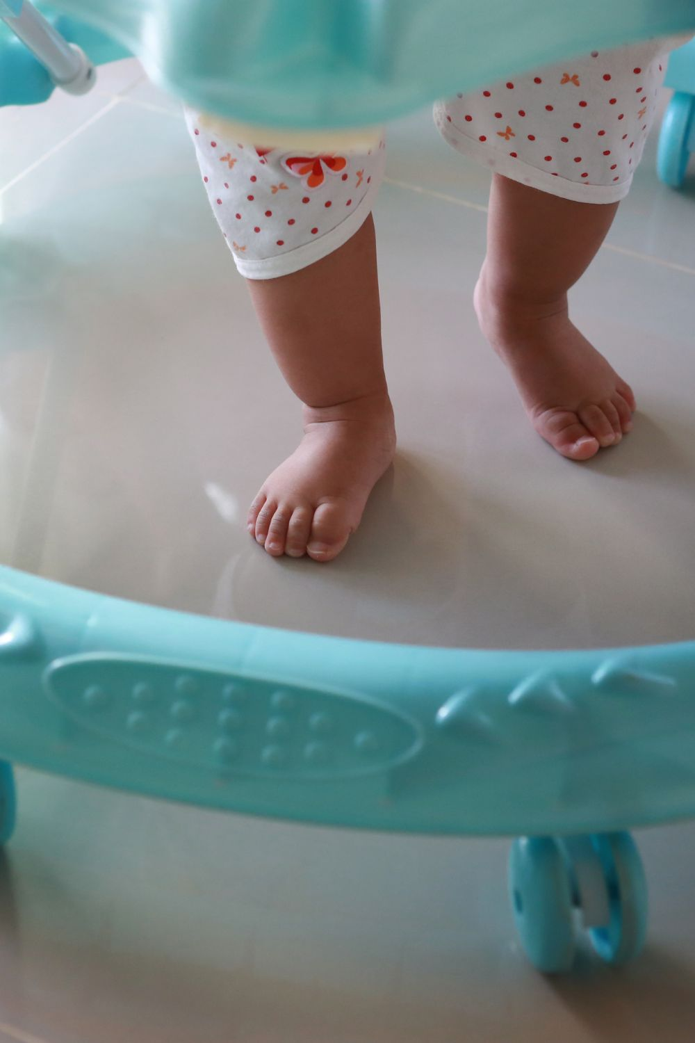 Baby feet in a walker