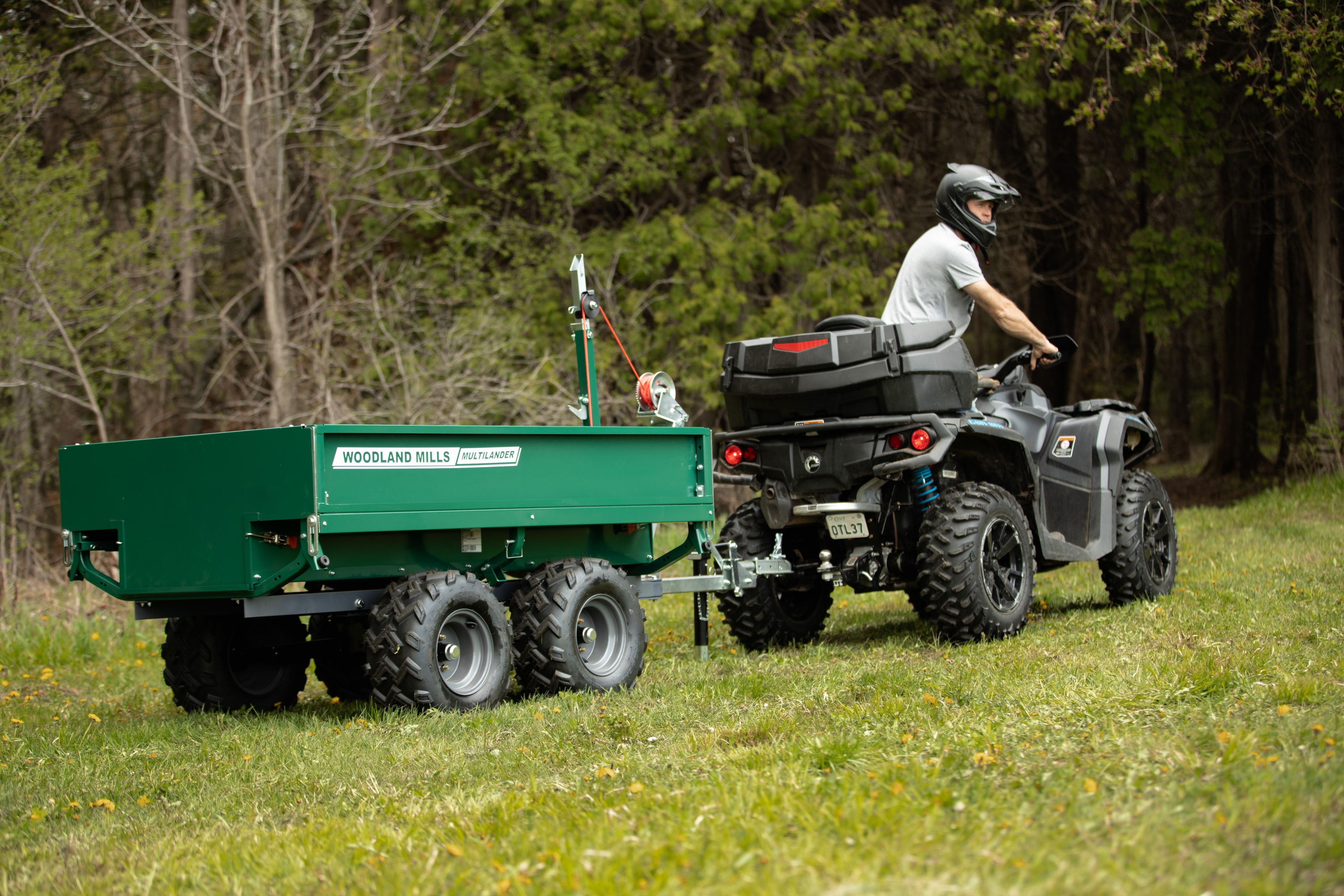 A Woodland Mills Multilander trailer hitched to an ATV.