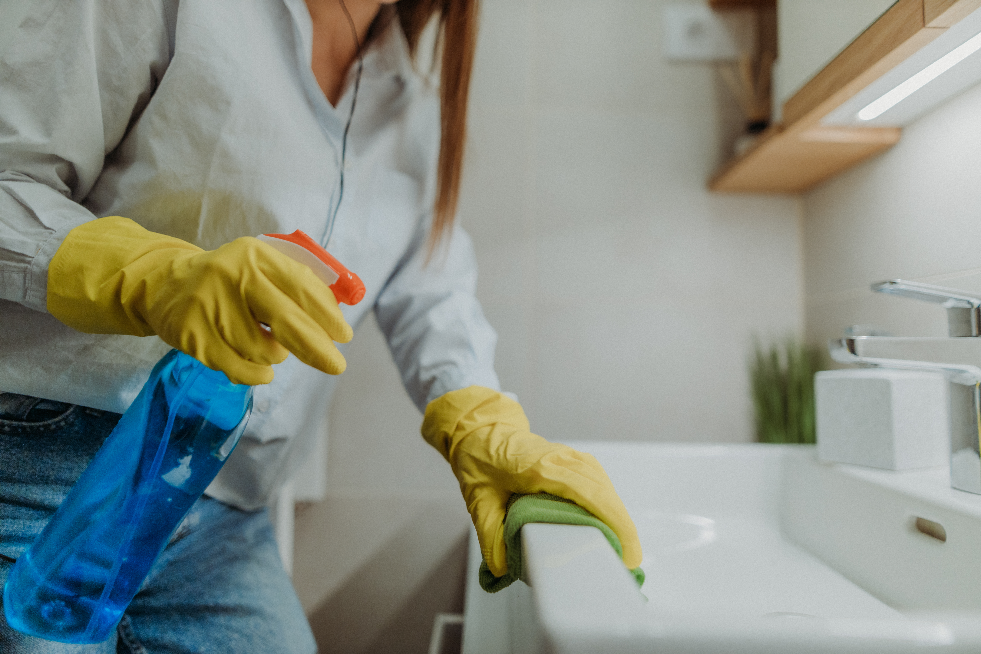 Cleaner using a dish soap homemade cleaning solution from natural products in a spray bottle to clean surfaces