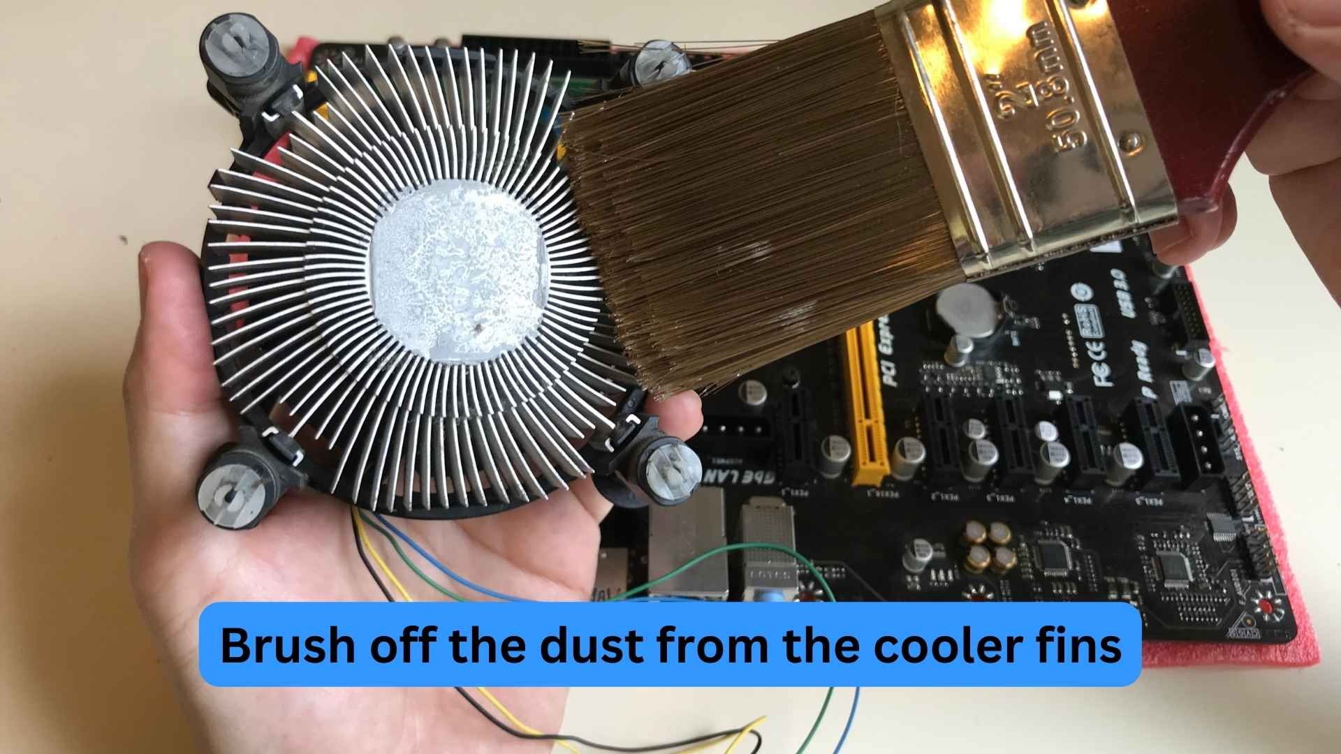 Brush off the dust from the cooler fins