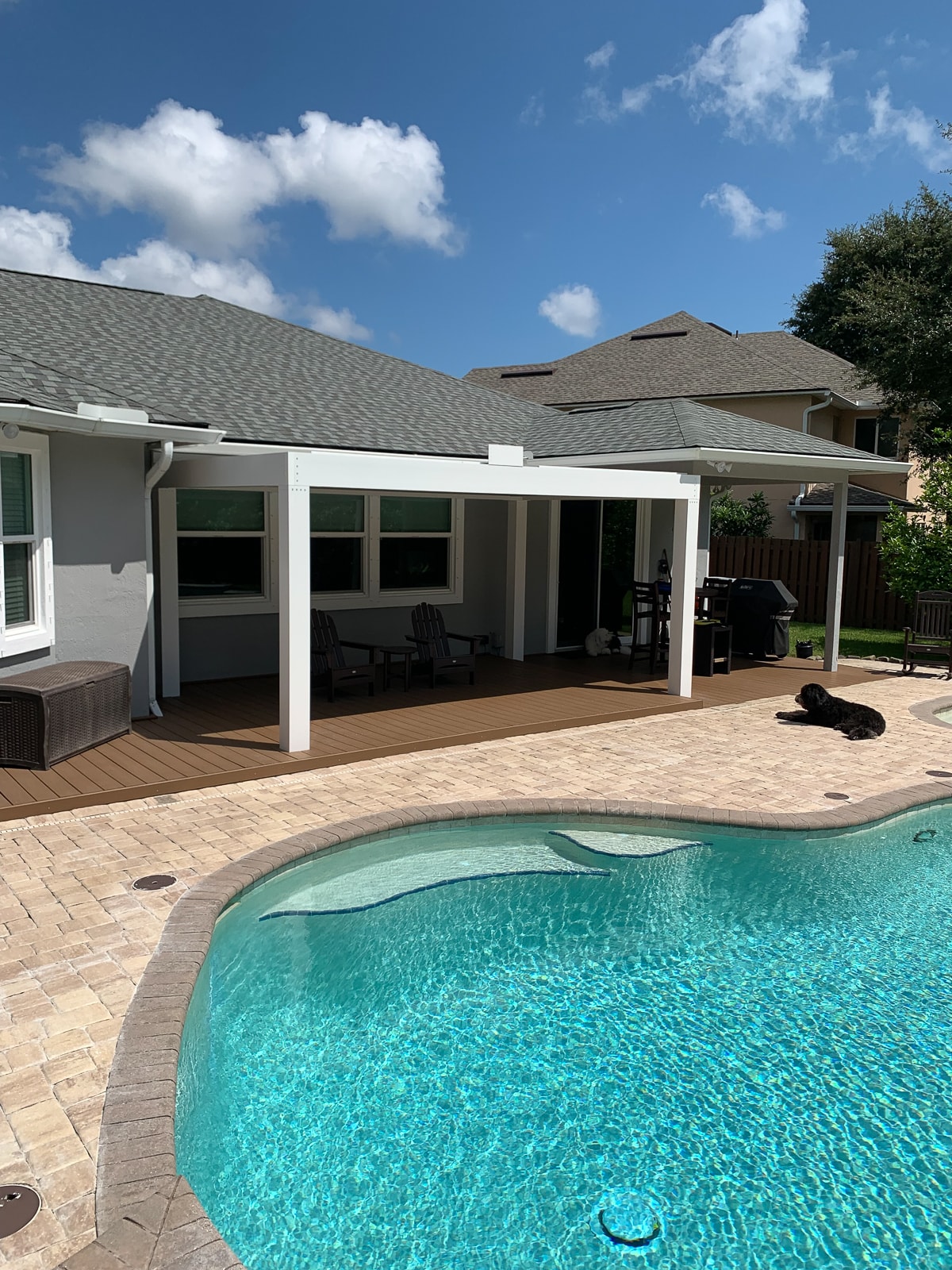 Beautiful Pergola next to a swimming pool.