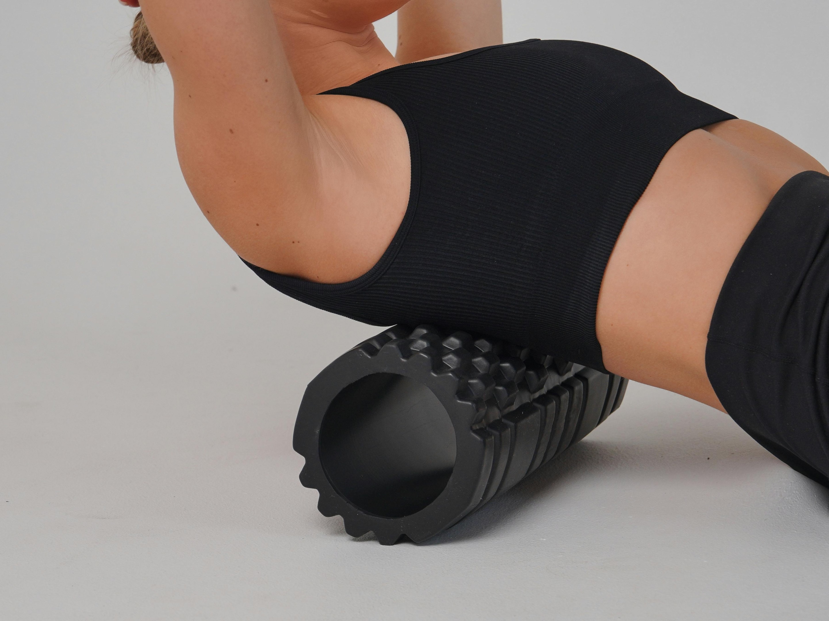 Photo by Nadin Sh: https://www.pexels.com/photo/woman-stretching-back-on-roller-20890280/