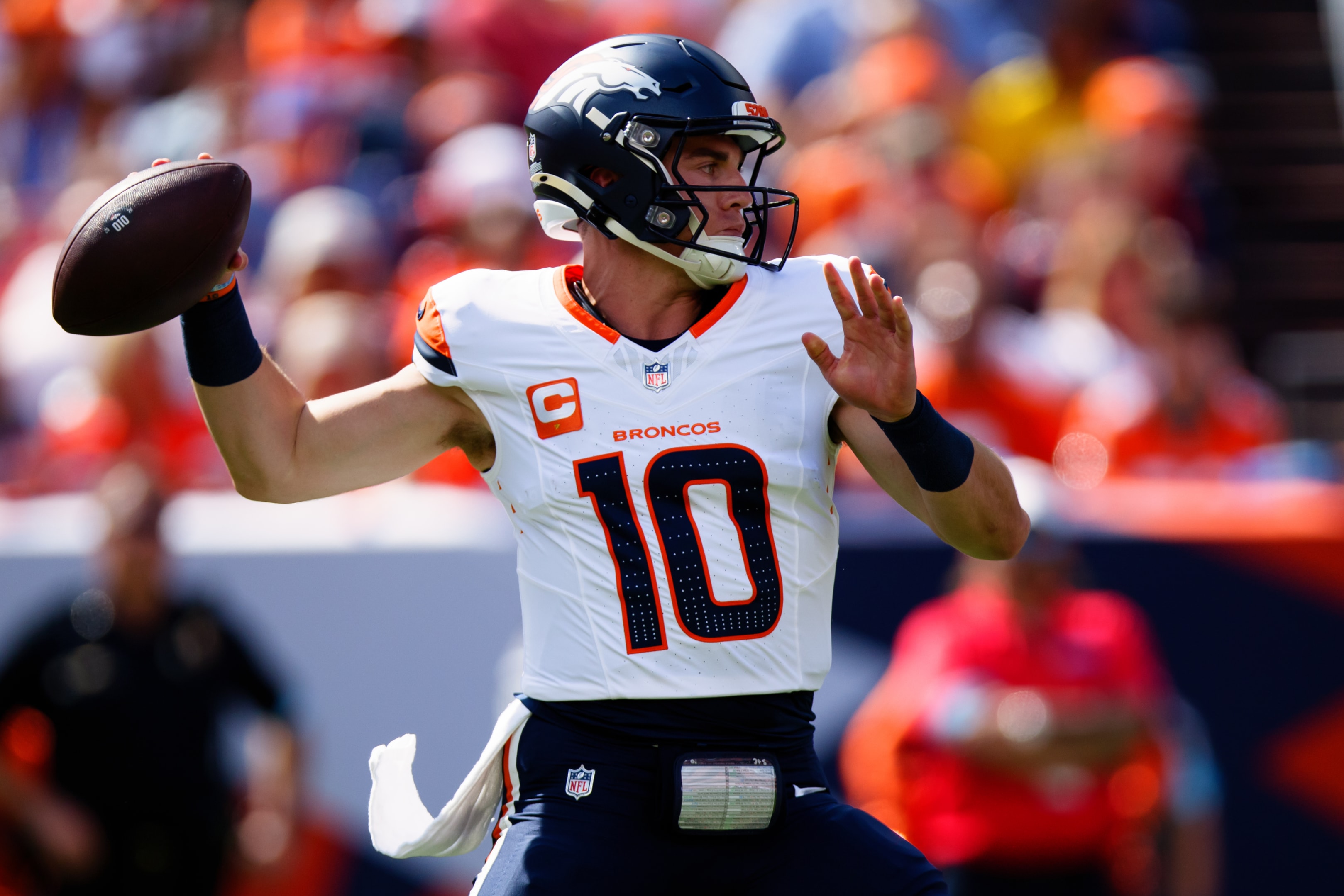 Quarterback Bo Nix of the Denver Broncos throws a pass in a game at Empower Field at Mile High on September 15, 2024 in Denver, Colorado.