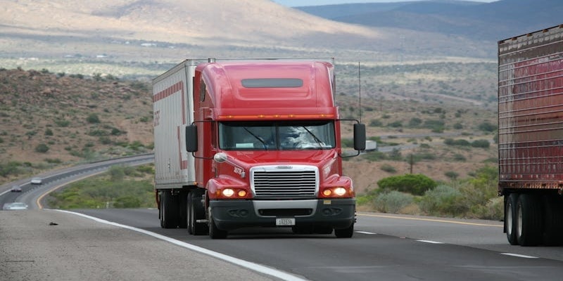 Commercial truck with fog lights on highway