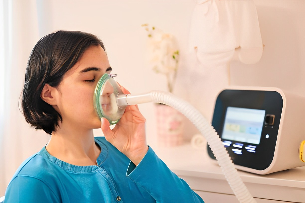 A photo of a woman using CPAP machine for her sleep apnea