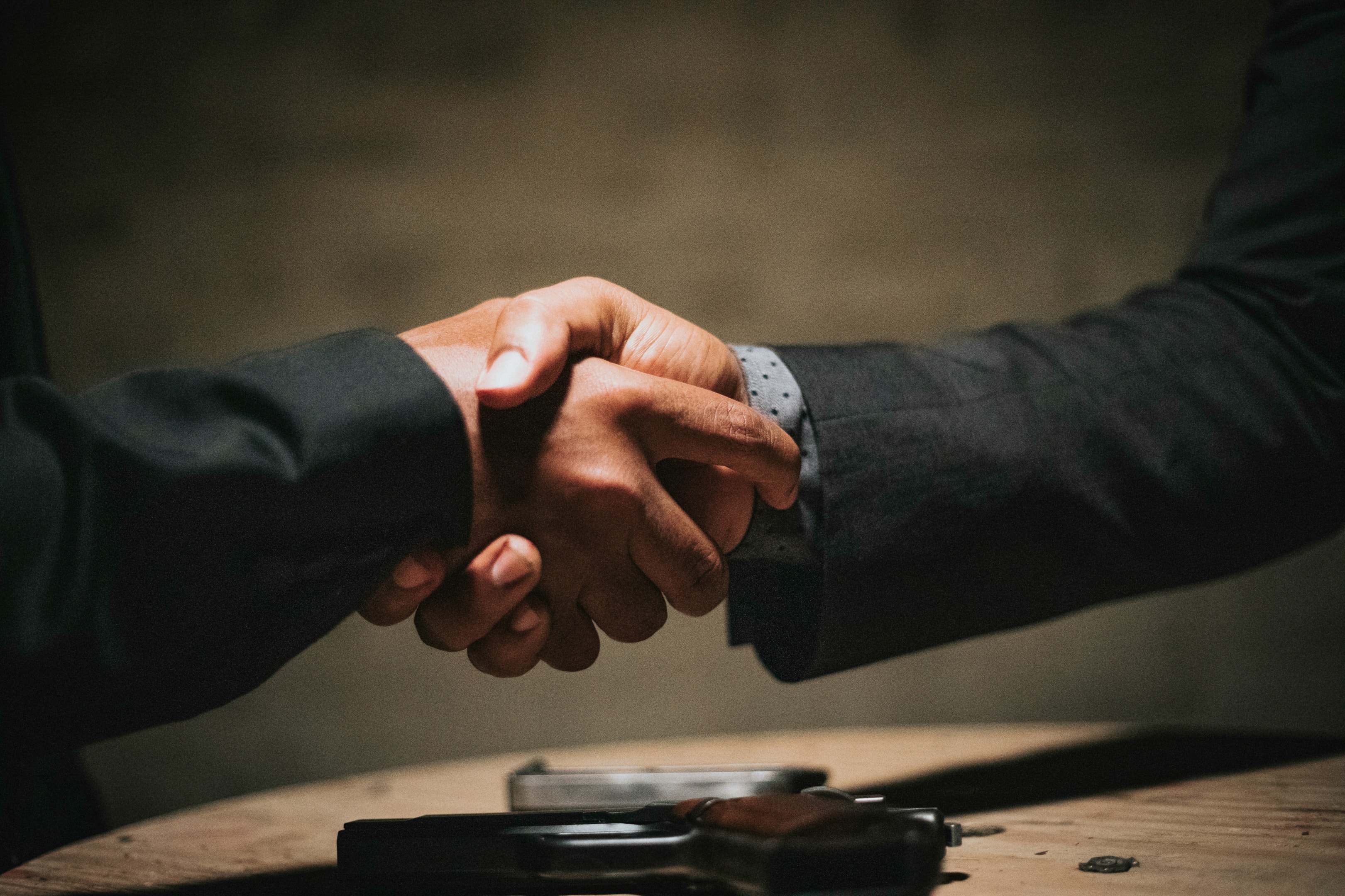 Handshake between real estate investor and home buyer.