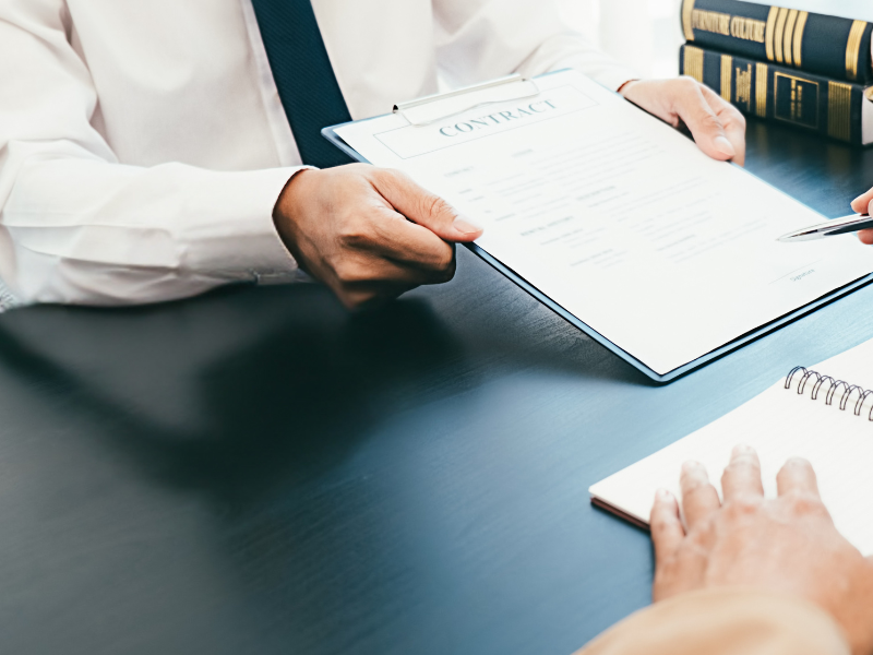 Image of a client speaking with a lawyer after a semi truck driver hit them.