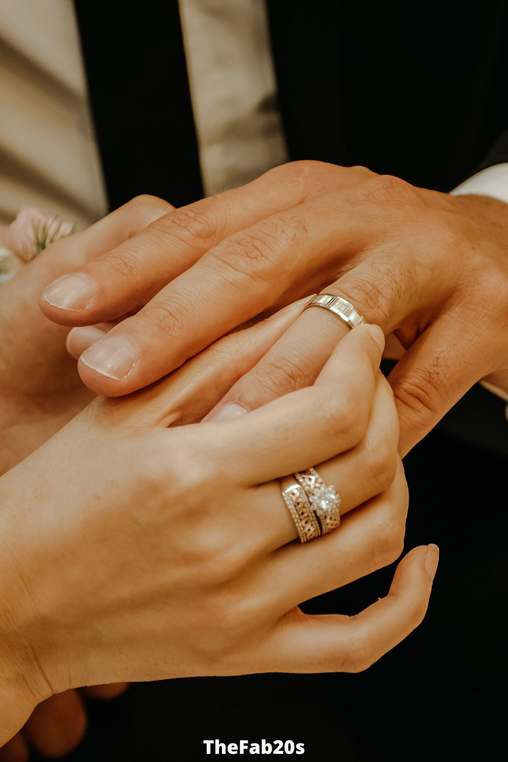 Marriied man putting on his wedding band - Featured In Signs a Married Man Is Using You